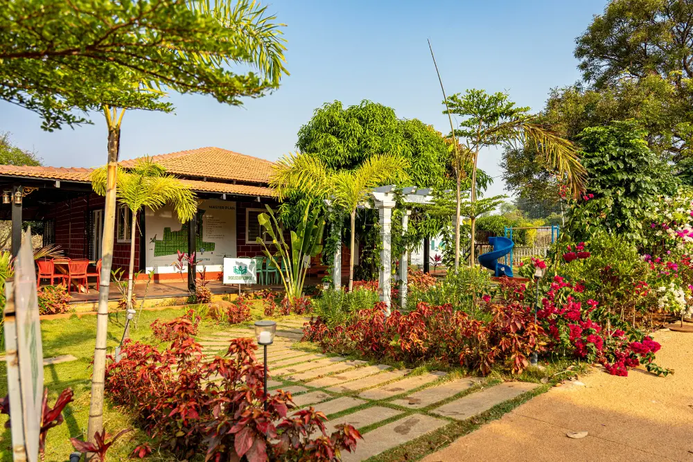 Entrance pathway at h20 farms with lush greenery and scenic farmland views