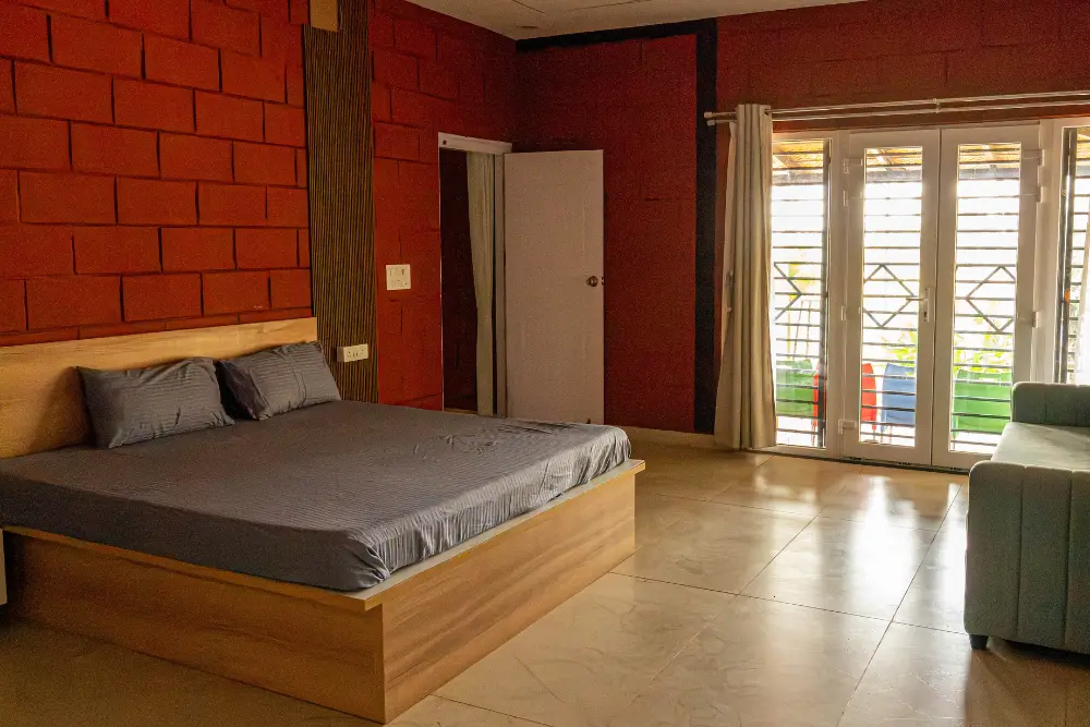 Guest bedroom at h20 farms with cozy interiors and a peaceful farm stay ambiance