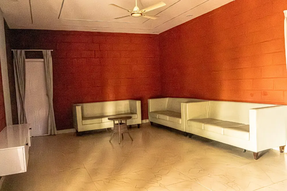 Guest house sitting area at h20 farms with comfortable seating and scenic farm views