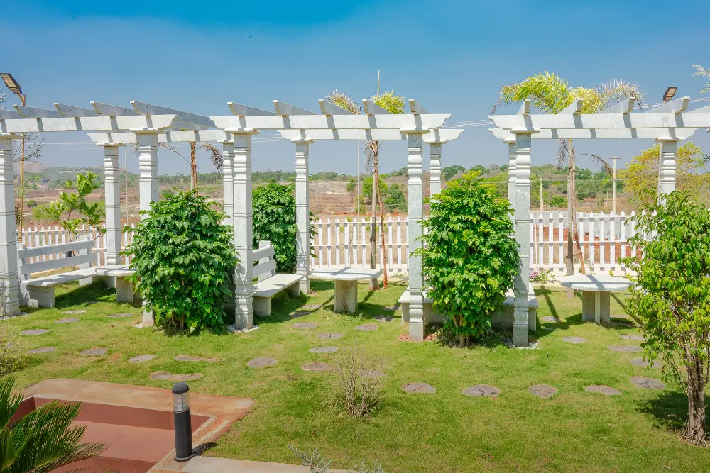 Seating area at tamara valley overlooking scenic views and lush natural surroundings.