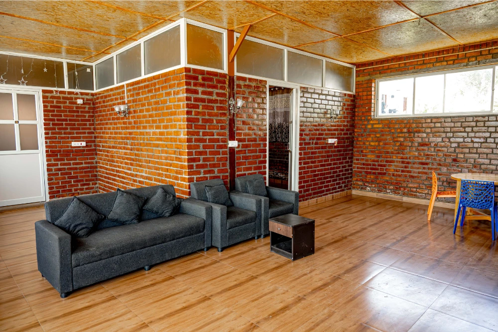 Interior of vasudha kalpataru guest house with modern design and comfortable living space.