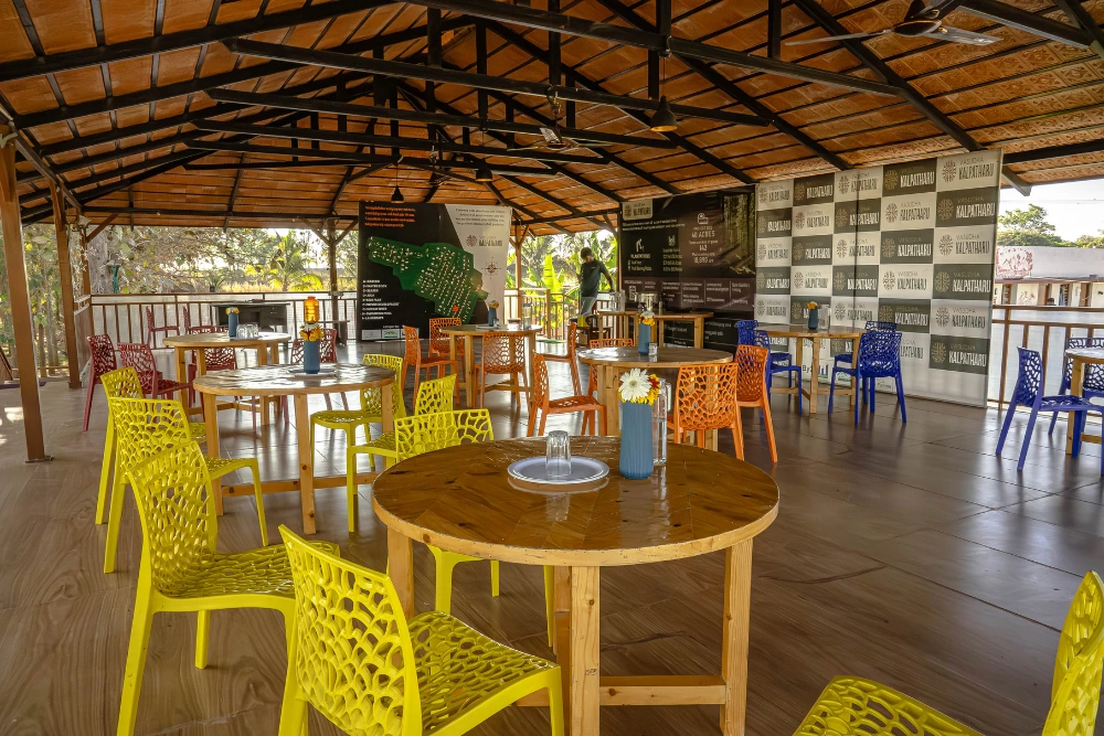 Seating area at vasudha kalpataru with scenic views and natural surroundings.